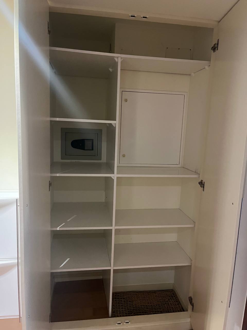 Custom fitted wardrobe with shelves and built-in safe, Algarve home
