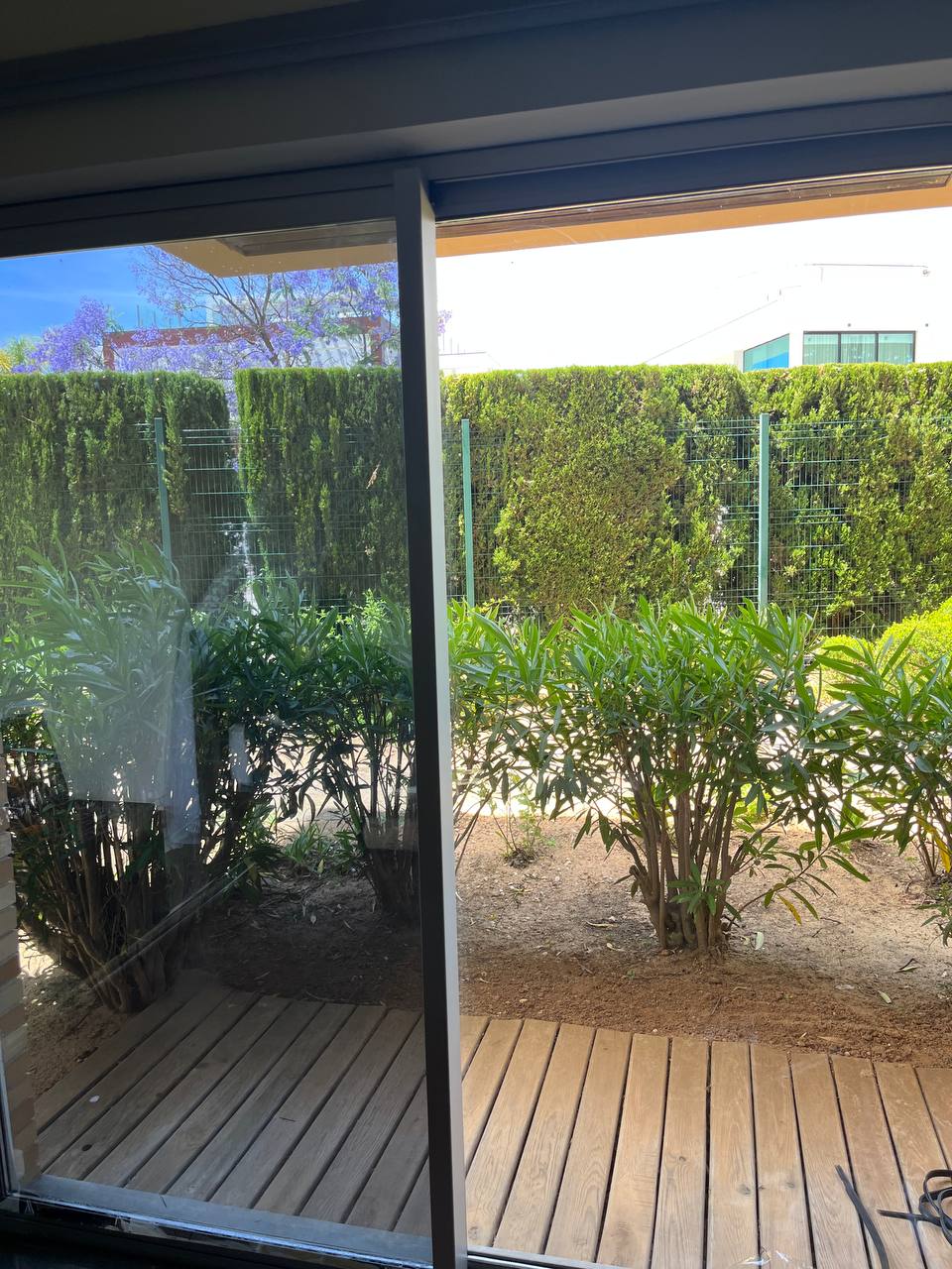 Mosquito screen on sliding patio door with garden view, Algarve