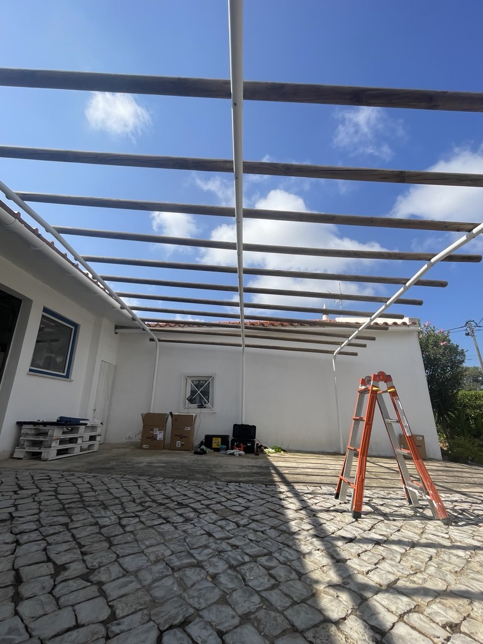 Pergola frame being installed on a terrace, Algarve