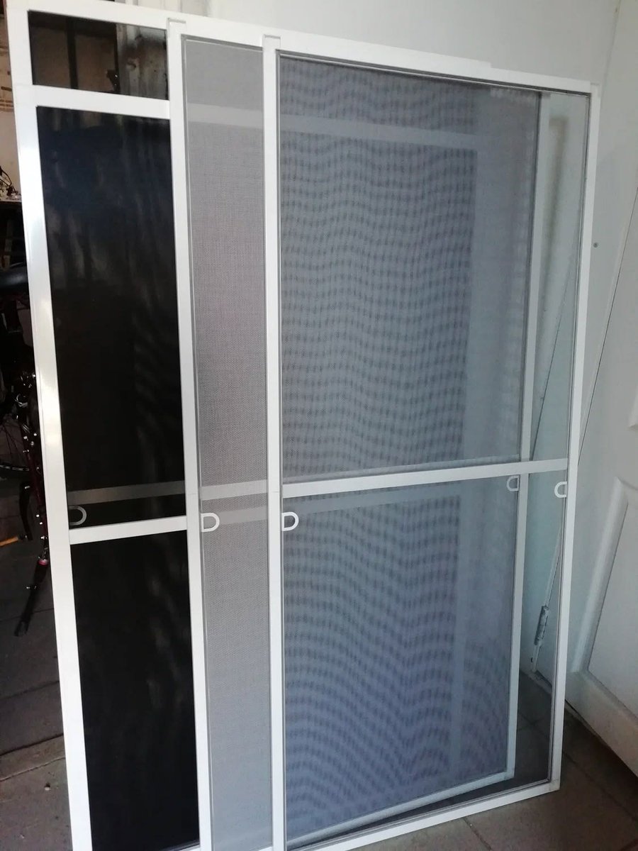 Mosquito screen frame close-up, installed on sliding window, Algarve