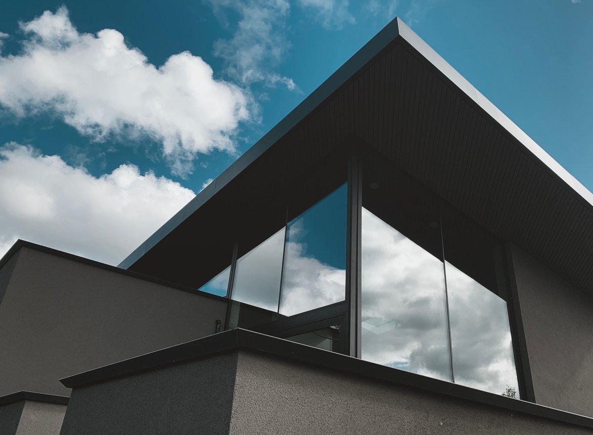 Architectural rooftop with reflective tinted glass windows